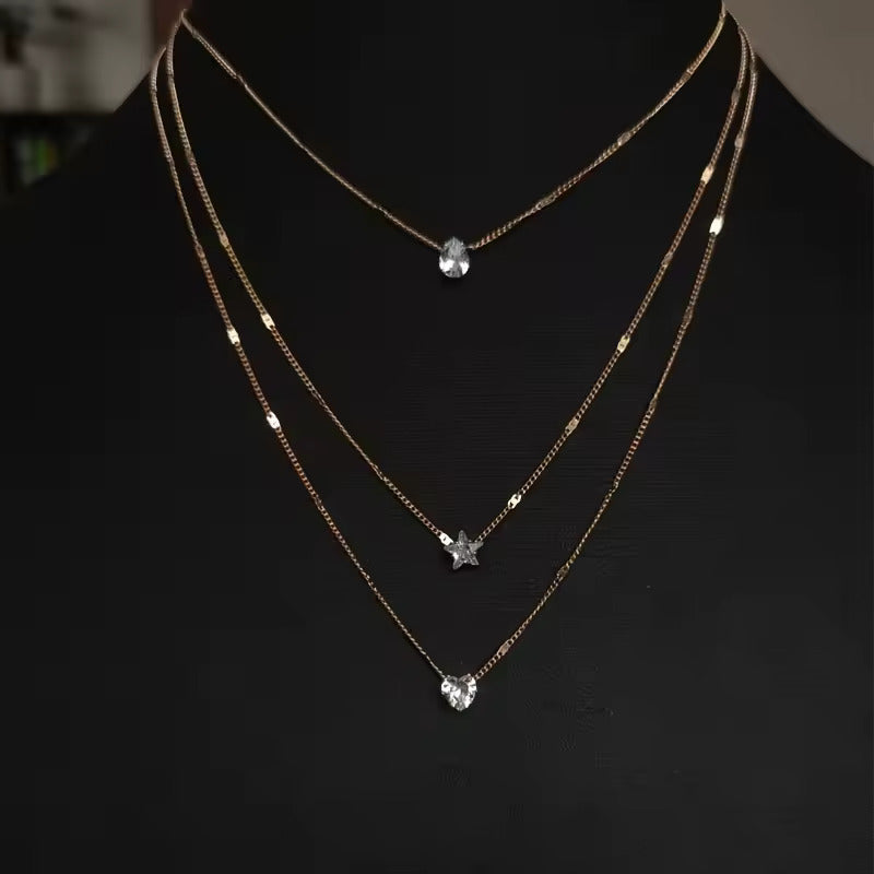 Damesketting goudkleurig – layered ketting met hart, ster en kristal – verstelbaar