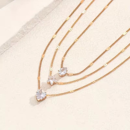 Damesketting goudkleurig – layered ketting met hart, ster en kristal – verstelbaar