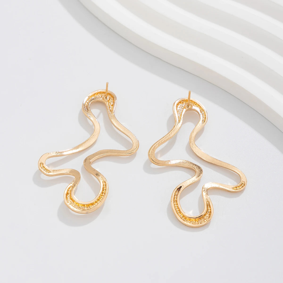 Elegance Curve Stud Earrings Close Golden