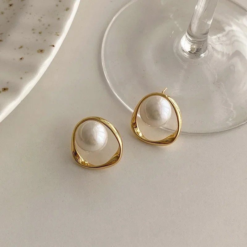 Elegant Orbit Pearl Stud Earrings Close
