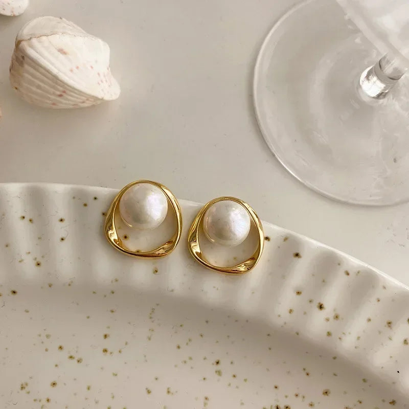 Elegant Orbit Pearl Stud Earrings Closeup