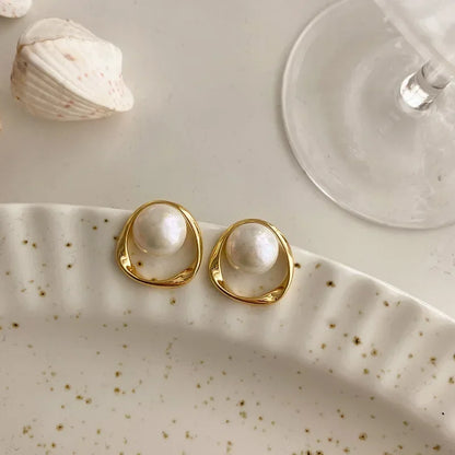 Elegant Orbit Pearl Stud Earrings Closeup